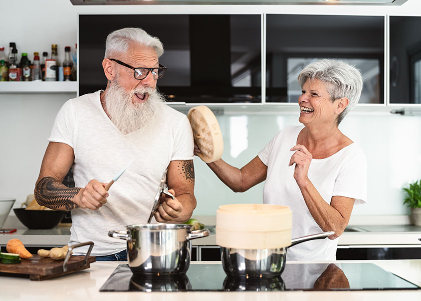 Happy couple cooking together